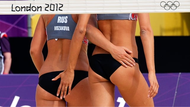 Russia's Anna Vozakova and Anastasia Vasina celebrate in the women's beach volleyball preliminary phase - Pool B match