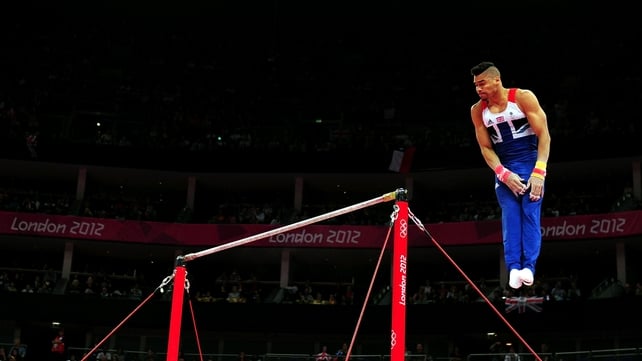 Louis Smith of Great Britain competes in the horizontal bars in the Artistic Gymnastics Men's Team qualification