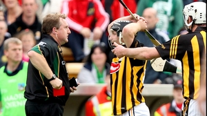 Richie Hogan knows what's coming as referee Wadding reaches for the red card.