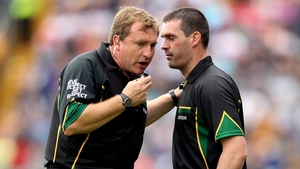 Referee Michael Wadding consults linesman James Owens before awarding a wide to Kilkenny