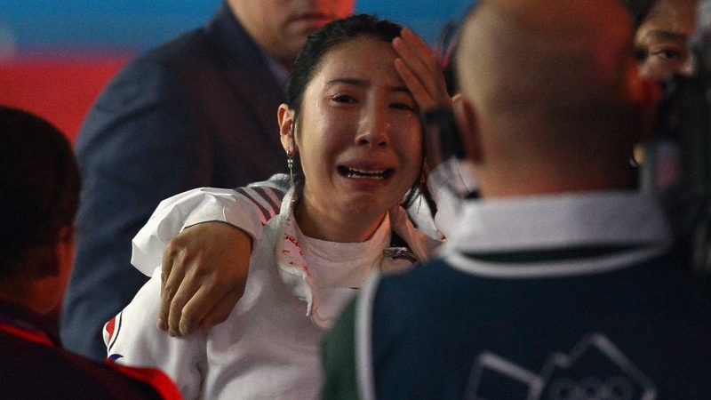 A distraught Shin A Lam leaves the arena