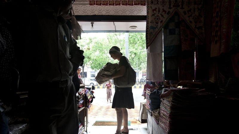 A customer shops in the dark in New Delhi during yesterday's power outage