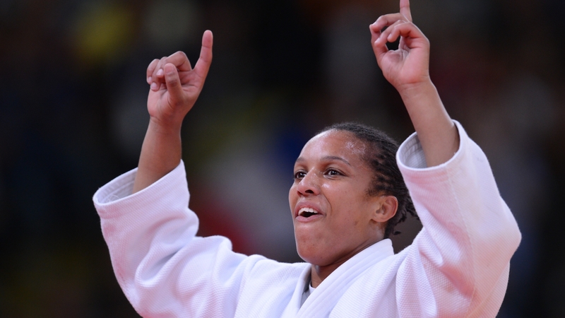 Lucie Decosse celebrates victory at the ExCel arena