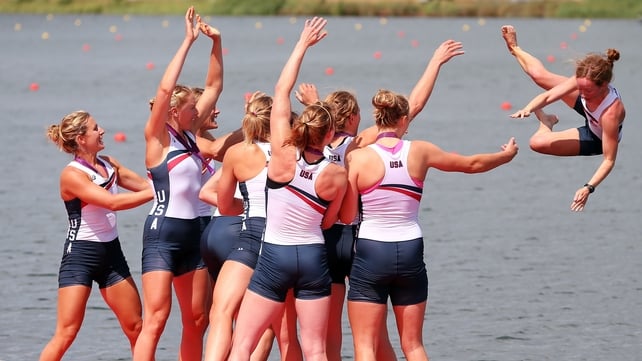 The thanks you get..Mary Whipple is thrown into the water by her crew after winning the women's eight final