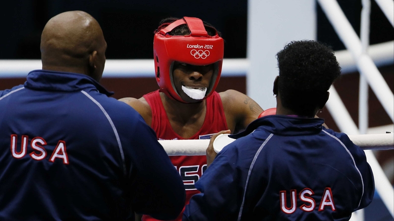 Rau'shee Warren of the USA is greeted by his corner after facing Nordine Oubaali of France