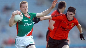 Down's Niall McParland tests the quality of Donal Vaughan's jersey