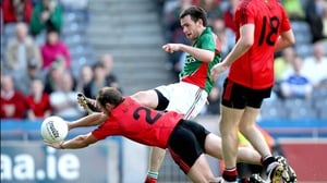 Darren O'Hagan attempts to block down Mayo's Kevin McLoughlin