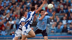 Michael Darragh Macauley's fisted effort is deflected to the Laois net by John O'Loughlin