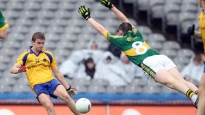 Roscommon's Kevin Finn kicks for goal as Kieran Murphy of Kerry tries to block