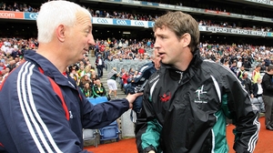 Cork manager Conor Counihan (l) commiserates with Kildare counterpart Kieran McGeeney