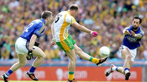 Paul Galvin tries to block a shot from Colm McFadden