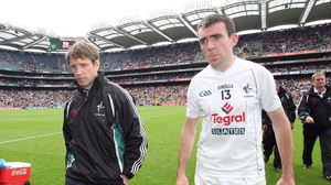 Kieran McGeeney and John Doyle of Kildare trudge off the pitch after their 2-19 to 0-12 defeat