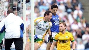Kerry goalkeeper Brendan Kealy and Aidan O'Mahony look on as Michael Murphy of Donegal celebrates Colm McFadden's sixth-minute goal