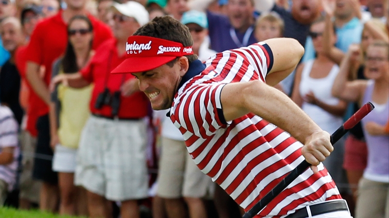 Keegan Bradley celebrates his par putt on the 18th green