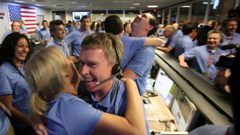 NASA ground control staff in Pasadena celebrate the successful landing