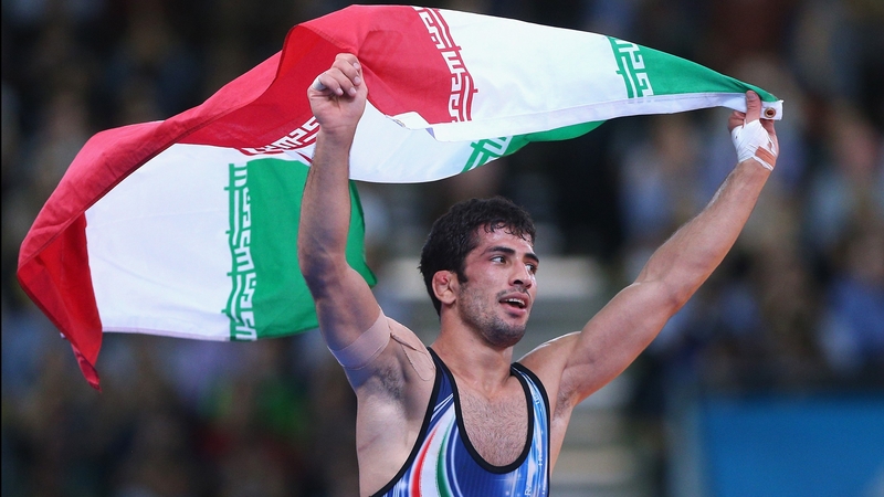 Omid Noroozi celebrates after winning wrestling gold