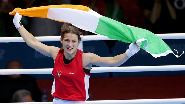 Circling the ring with her national colours flying above her