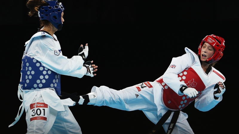 Jade Jones (R) lands a kick on Yuzhuo Hou