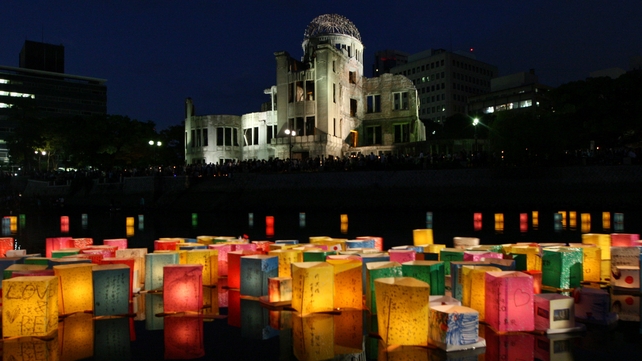 Paper lanterns float on the Motoyasu River in front of the Hiroshima Peace Memorial on the 67th anniversary of the atomic attack on the city