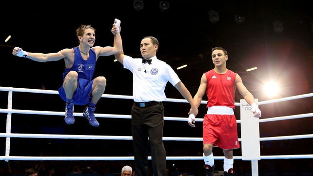 Irish boxer Michael Conlan jumps for joy after securing a medal in the Olympic flyweight competition