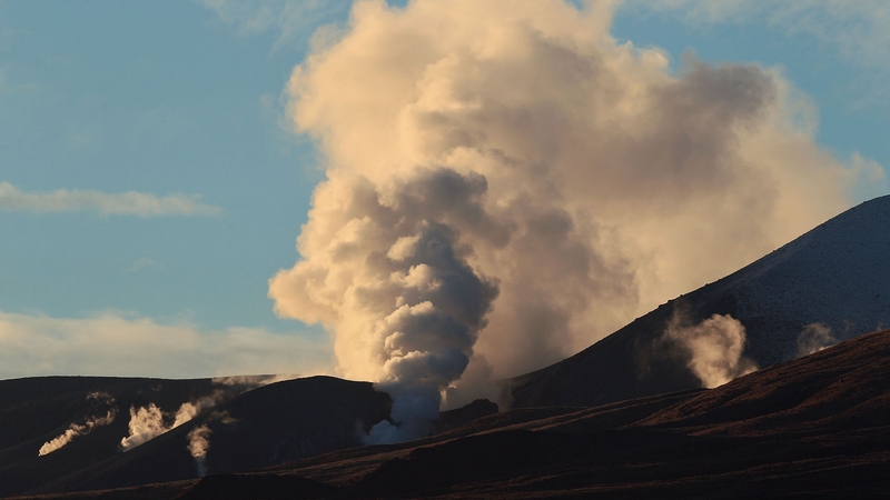 Steam spills from Mount Tongariro in New Zealand after the volcano erupted for the first time in over 100 years