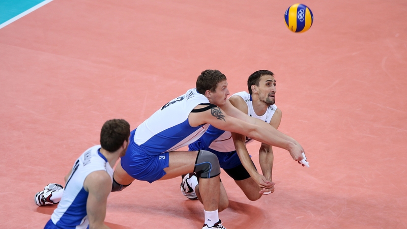 Alexander Sokolov (right) and Nikolay Apalikov (centre) of Russia dive for the ball against Bulgaria