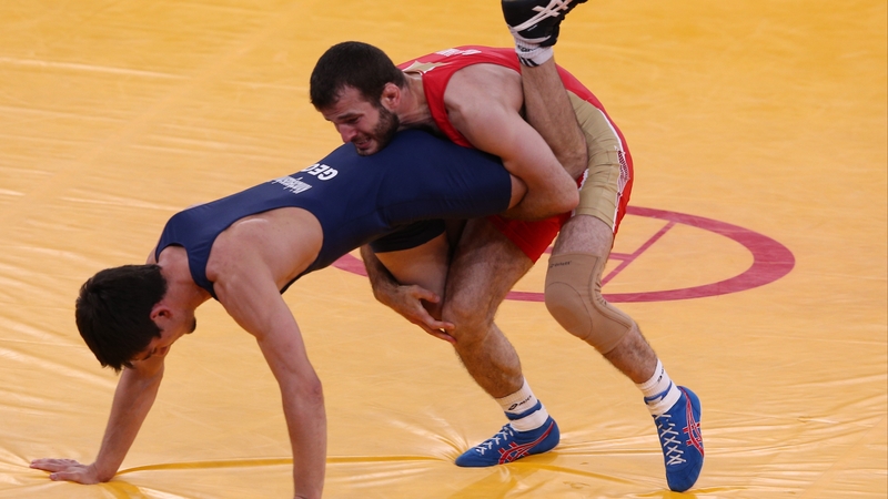 Dzhamal Otarsultanov of Russia (red) and Vladimer Khinchegashvili of Georgia