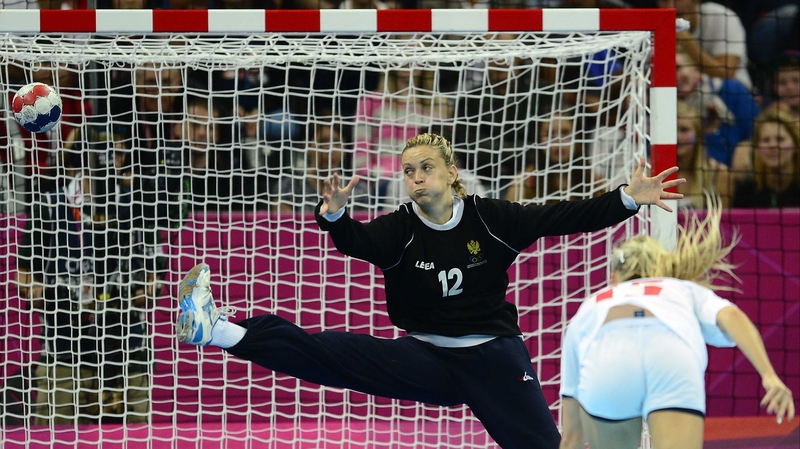 Norway's Linn Jorum Sulland shoots against Montenegro's goalkeeper Sonja Barjaktarovic
