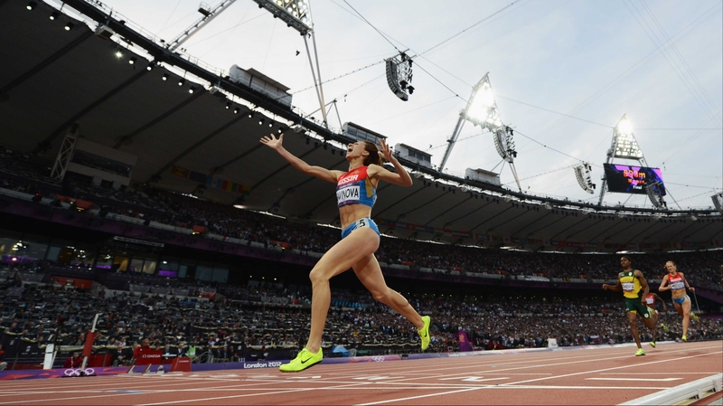 Mariya Savinova of Russia celebrates as she crosses the finish line