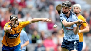 Dublin's Caolan Conway scores his sides second goal despite the best efforts of Clare's Brian Carey