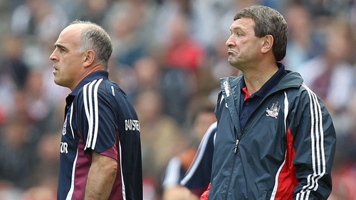 Managers Anthony Cunningham of Galway and Jimmy Barry-Murphy Cork look on as their charges do battle