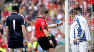 Referee David Hughes consults his umpires regarding a late Clare point that was signalled wide