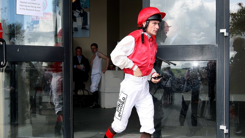 Pat Smullen runs to the parade ring as a late replacement for Johnny Murtagh who was injured after being thrown from Lottie Dod before the start of the Keeneland Phoenix Stakes at the Curragh