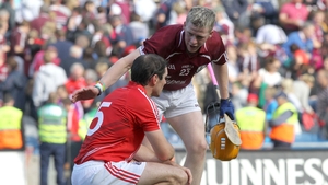 Galway's Davy Glennon consoles Tom Kenny of Cork