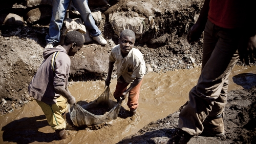 Children wash copper at an open-air mine in Kamatanda in the rich mining province of Katanga, Congo