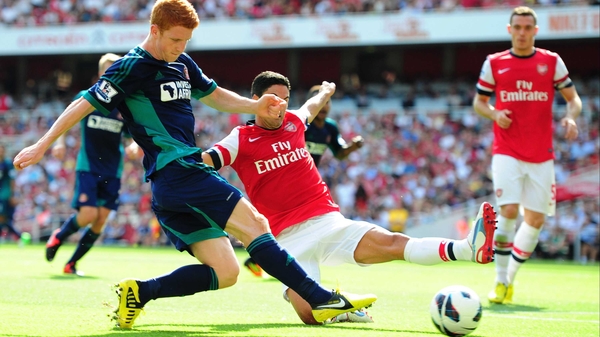 Jack Colback of Sunderland and Mikel Arteta of Arsenal