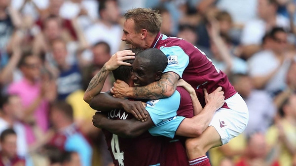 Kevin Nolan of West Ham (left) celebrates with team-mates Carlton Cole and Matthew Taylor after scoring the opening goal