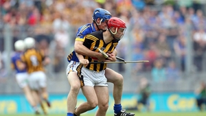Pa Bourke of Tipperary drags Tommy Walsh of Kilkenny to the ground