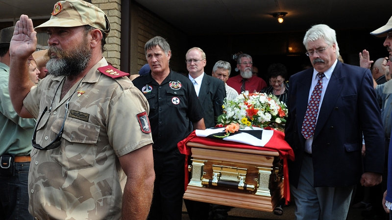AWB members carry the coffin of their leader Eugene Terre'Blanche as they leave a church in Ventersdorp on 9 April 2010