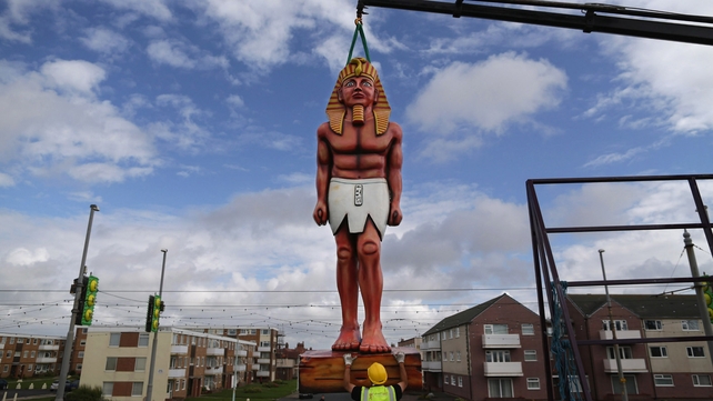 A worker prepares to install a large Egyptian-themed model on Blackpool Promenade as part of the town's illuminations festival