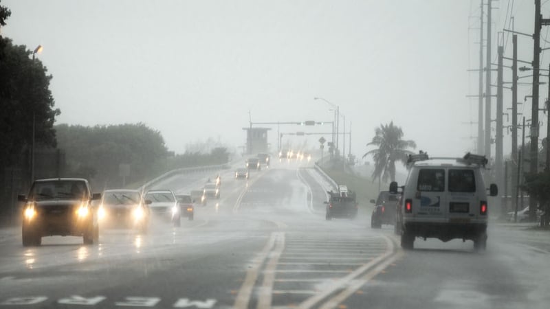 Cars leave the Lower Keys in Key West, Florida where residents are preparing after a hurricane warning was issued