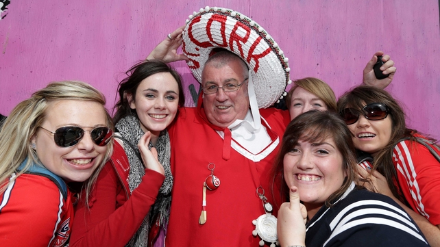 Well-known Cork GAA fan Cyril Kavanagh is surrounded by fellow Rebels