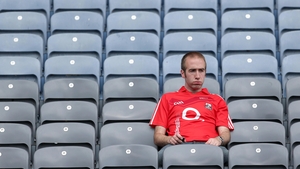 A dejected Cork fan is left to mull over his side's loss
