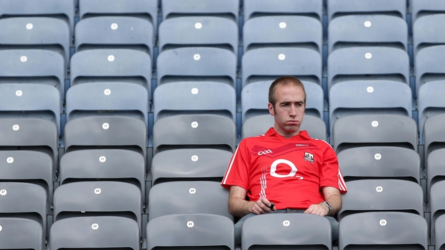 A dejected Cork fan is left to mull over his side's loss