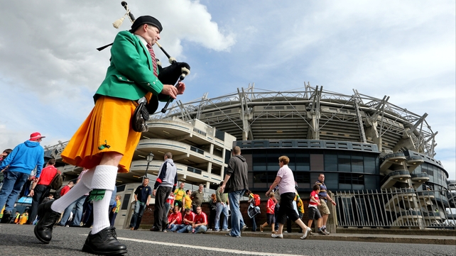 Chrisy Murray from Raphoe, Co Donegal, plays the pipes on Jones's Road before the senior game