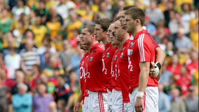The Cork team stand for the national anthem