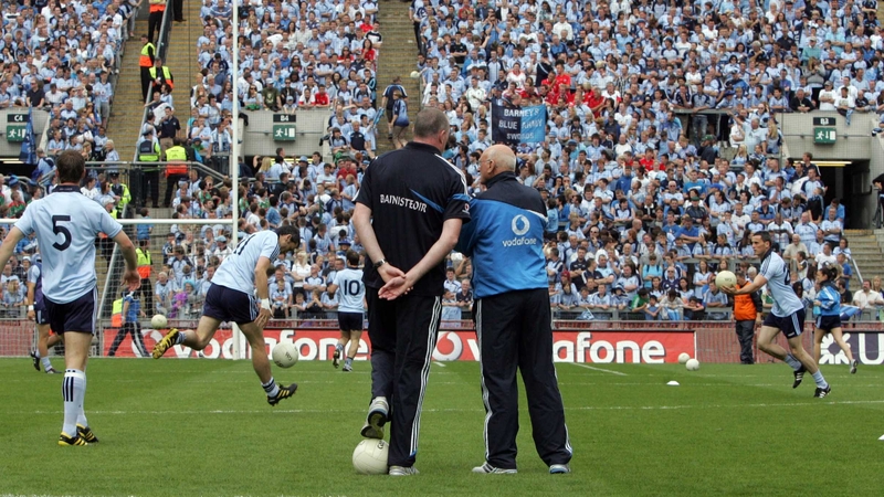 Manager Pat Gilroy (L) and coach Mickey Whelan look on as Dublin warm up in front of Hill 16