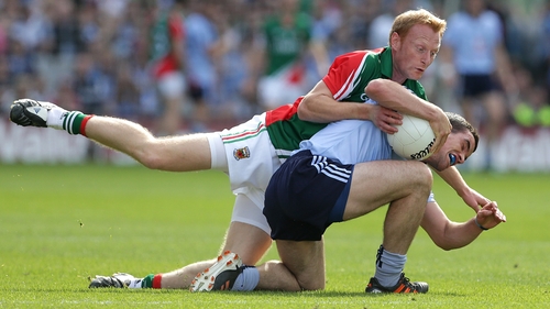 Dublin's Ger Brennan is put under pressure by Richie Feeney