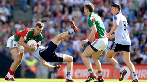 Mayo's Aidan O'Shea (l) and Denis Bastick of Dublin wrestle for possession as Eamon Fennell (r) and Barry Moran look on