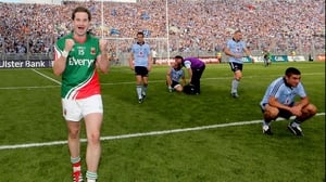 Mayo's Michael Conroy celebrates as Dublin payers come to terms with their 0-19 to 0-16 defeat